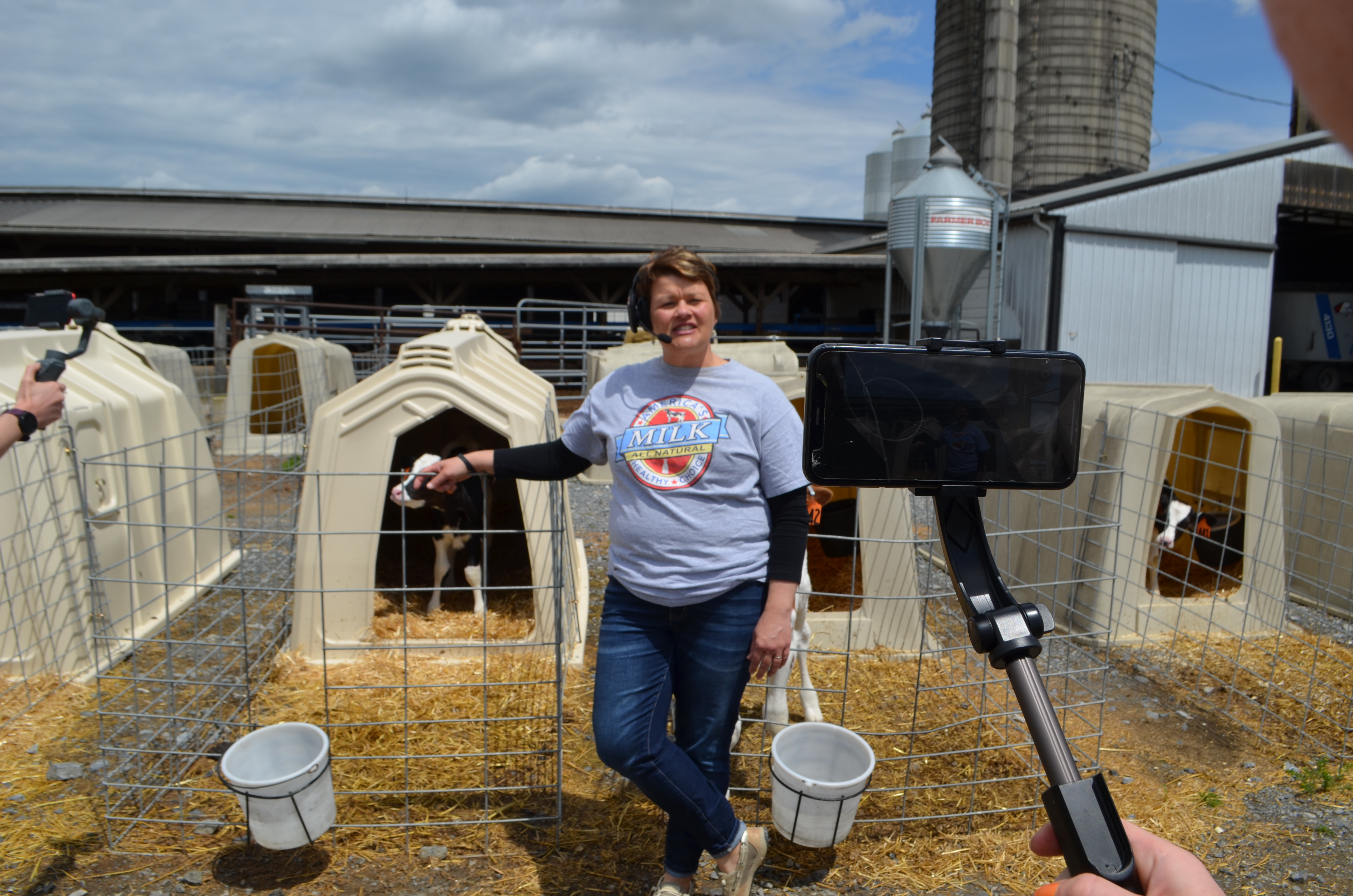 Stacey Tour 4 Woman filmed standing in front of a calf pen